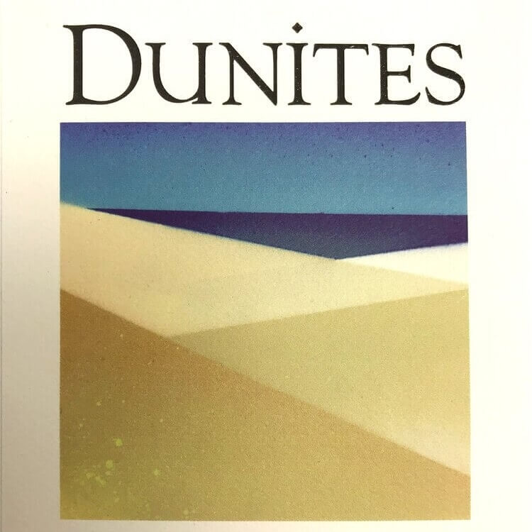 Dunites Jespersen Ranch Chardonnay 2019 label; Light beige label with dark text above a picture of sand dunes set against dark blue sea and blue sky