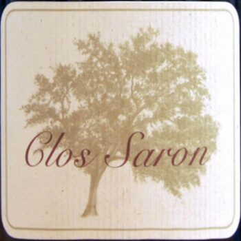 Clos Saron; Square label, beige fading to white, with dark blue border.Darker beige tree silhouette, brown script.