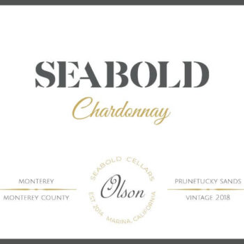 Seabold Olson Chardonnay 2018; A black bordered white rectangular label. Black and gold text towards the top. Two lines of black text towards the bottom, divided horizontally by a gold separator. The text is separated further by a circle of gold text in the middle, with more grey text inside the circle.
