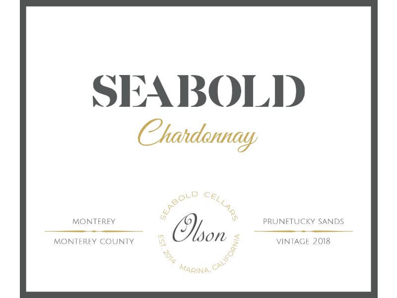 Seabold Olson Chardonnay 2018; A black bordered white rectangular label. Black and gold text towards the top. Two lines of black text towards the bottom, divided horizontally by a gold separator. The text is separated further by a circle of gold text in the middle, with more grey text inside the circle.