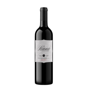 Kiona Malbec 2018; A white rectangular label with mainly black text. The text overlays a dark grey line drawing of many hills